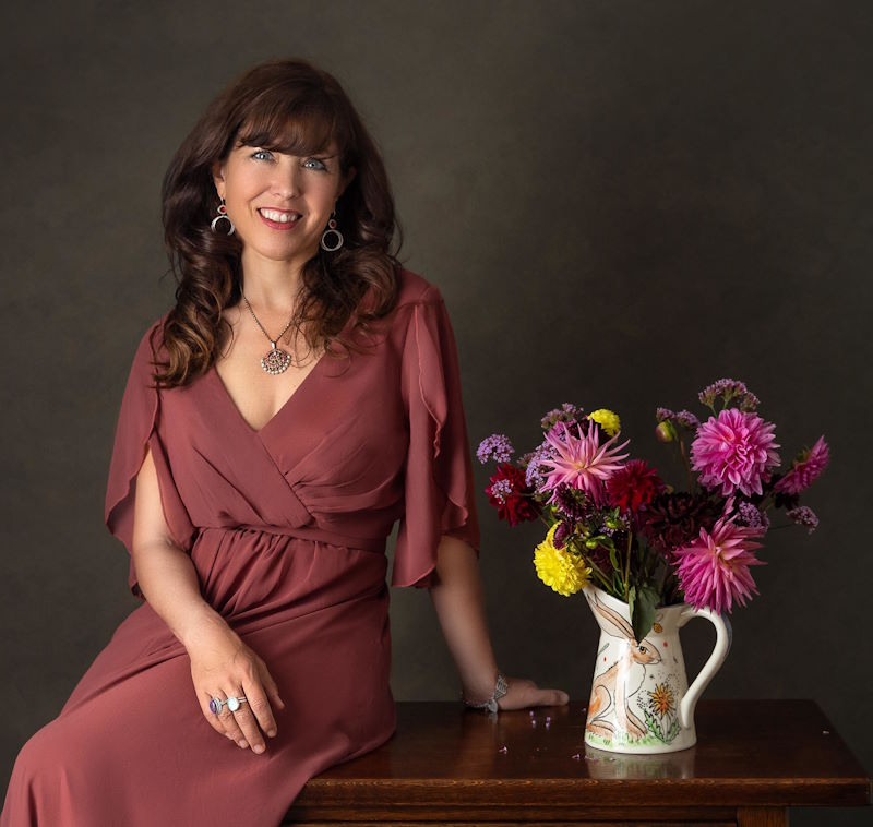 Colourful picture of Kate with a vase of flowers